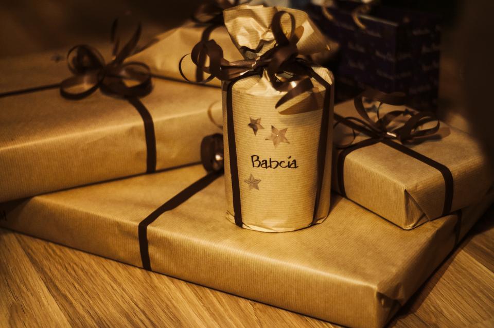 Gifts wrapped in plain brown paper with ribbon